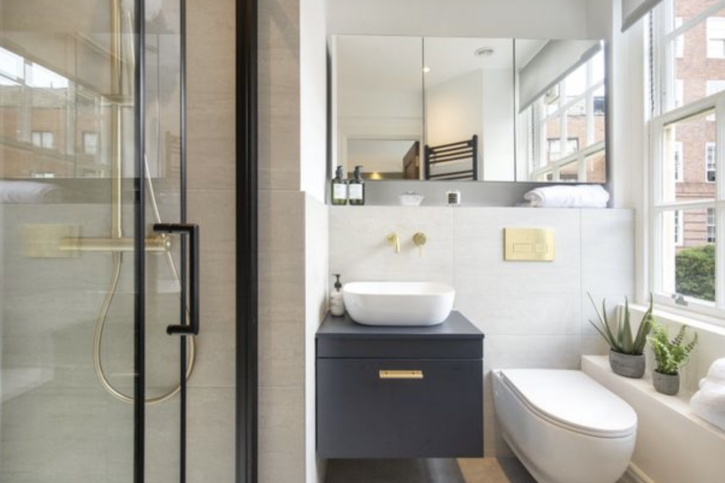 Freshly cleaned modern bathroom with bright natural light