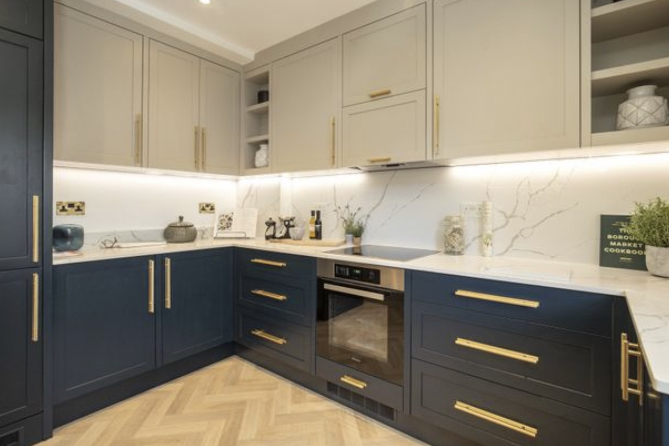Premium kitchen with navy cabinets and marble worktops